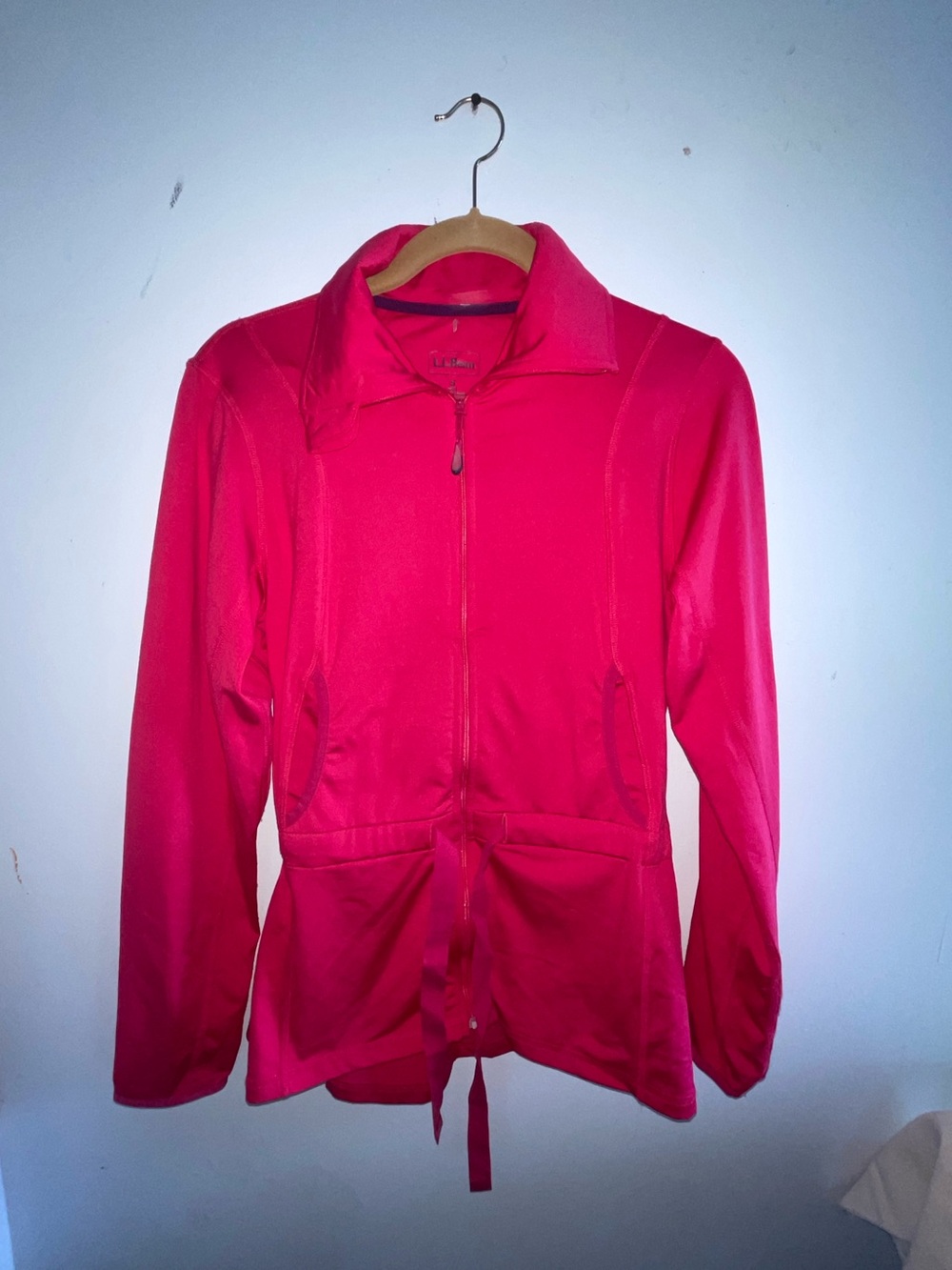 bright pink zip-up jacket is from L.L.Bean and features a drawstring waist